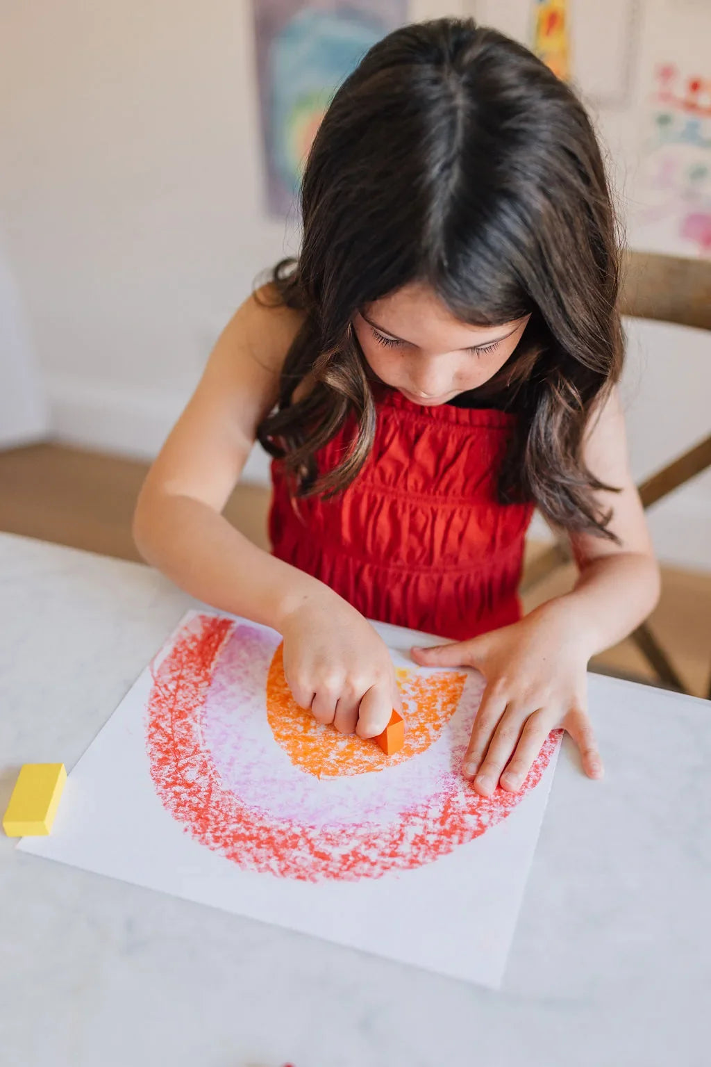 Girl coloring a rainbow with Beeswax Block Crayons